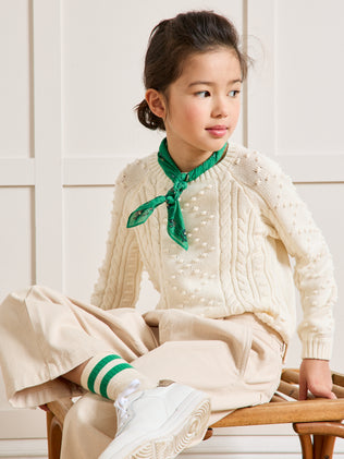 Girl's cable-knit sweater